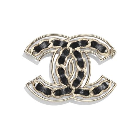 chanel metal and calfskin brooch|Chanel brooches near me.